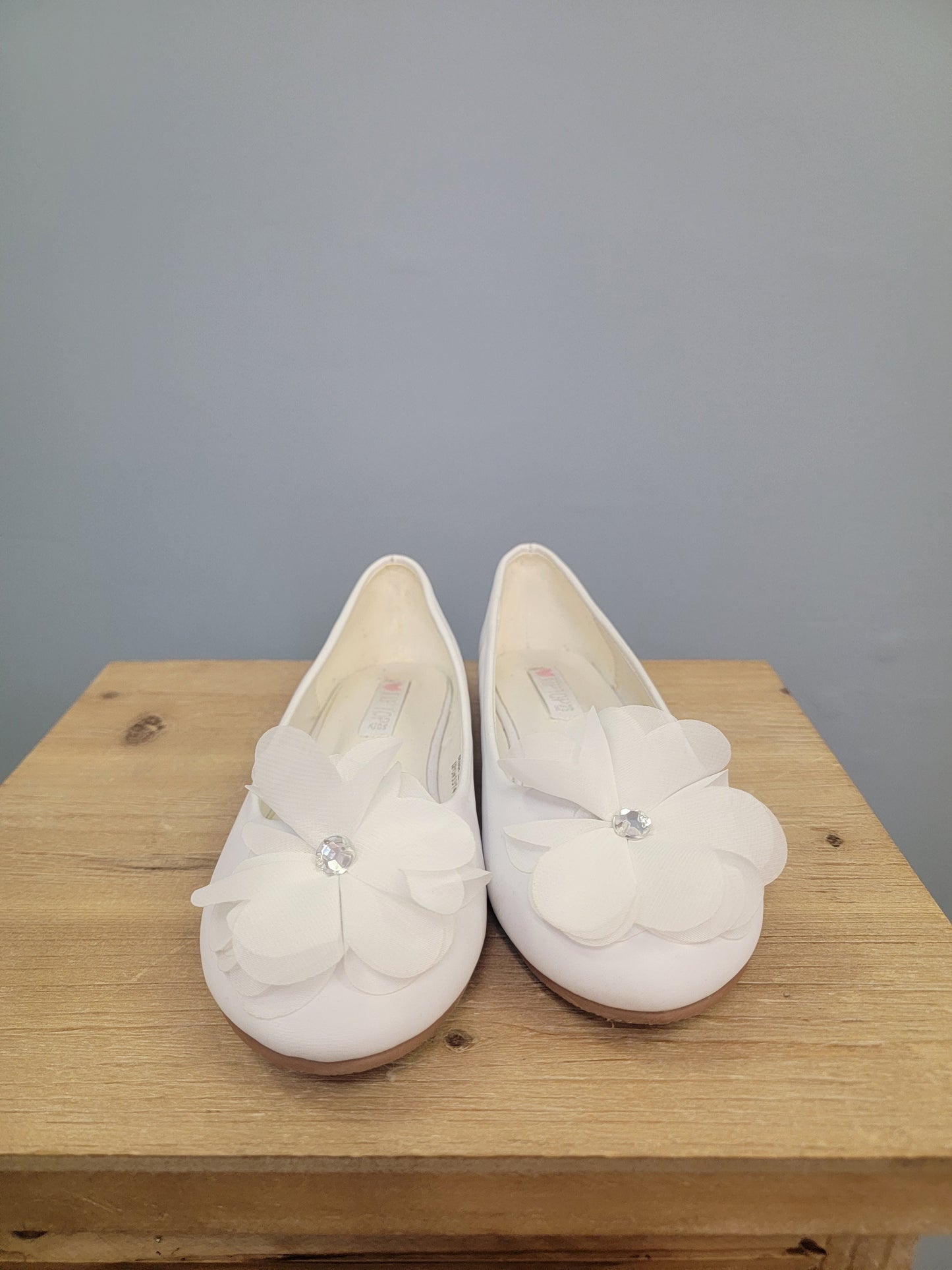 white girl's flats with flower on toe