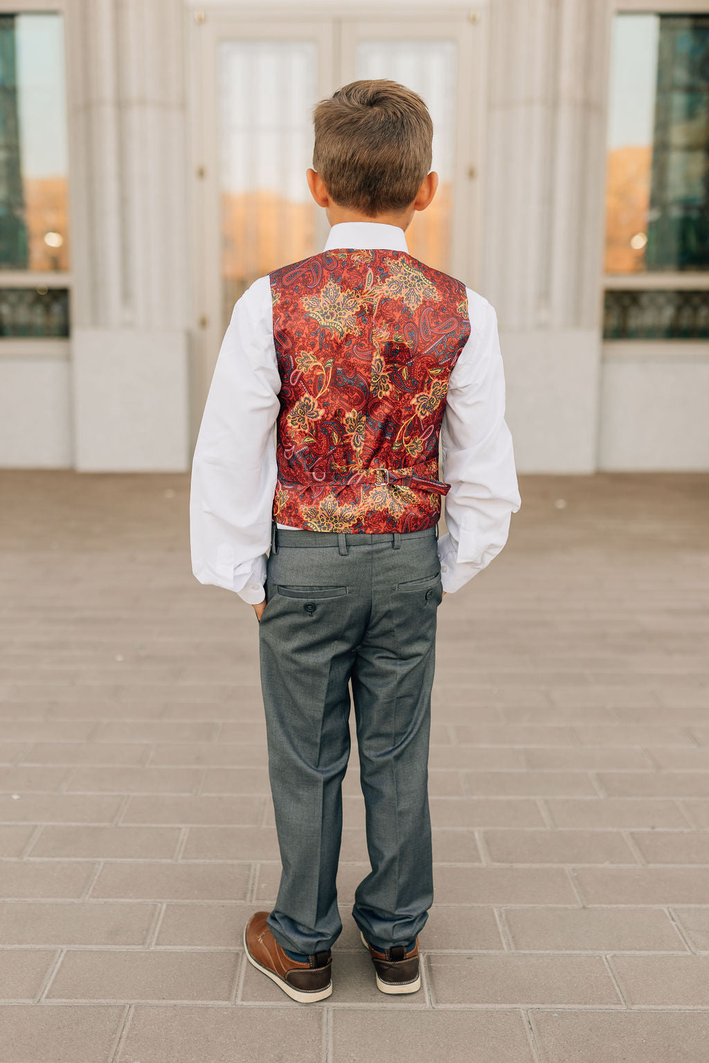 boy in charcoal suit-back view