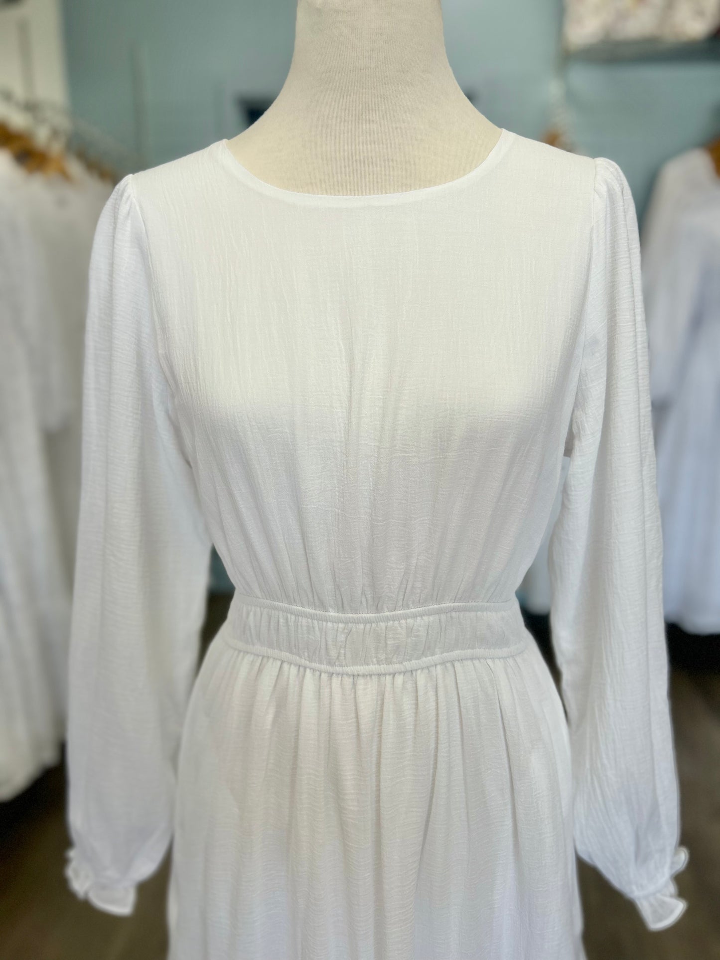 White dress with tiered lace panel skirt.