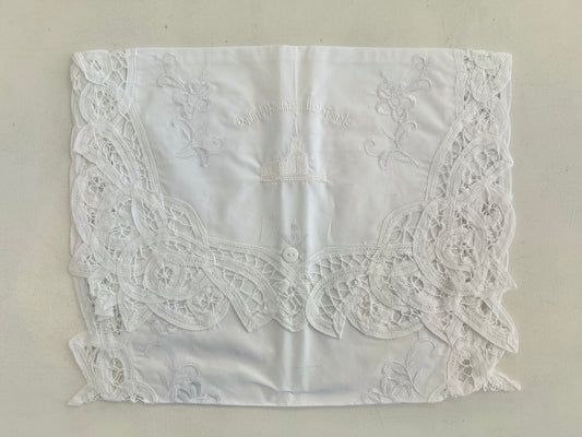 White cotton envelope with embroidery.
