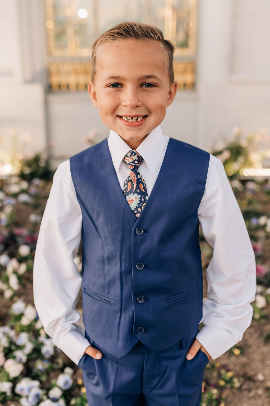 boy in blue vest and matching pants