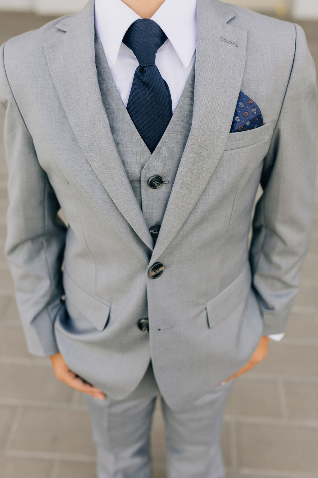 detail of boy's gray suit