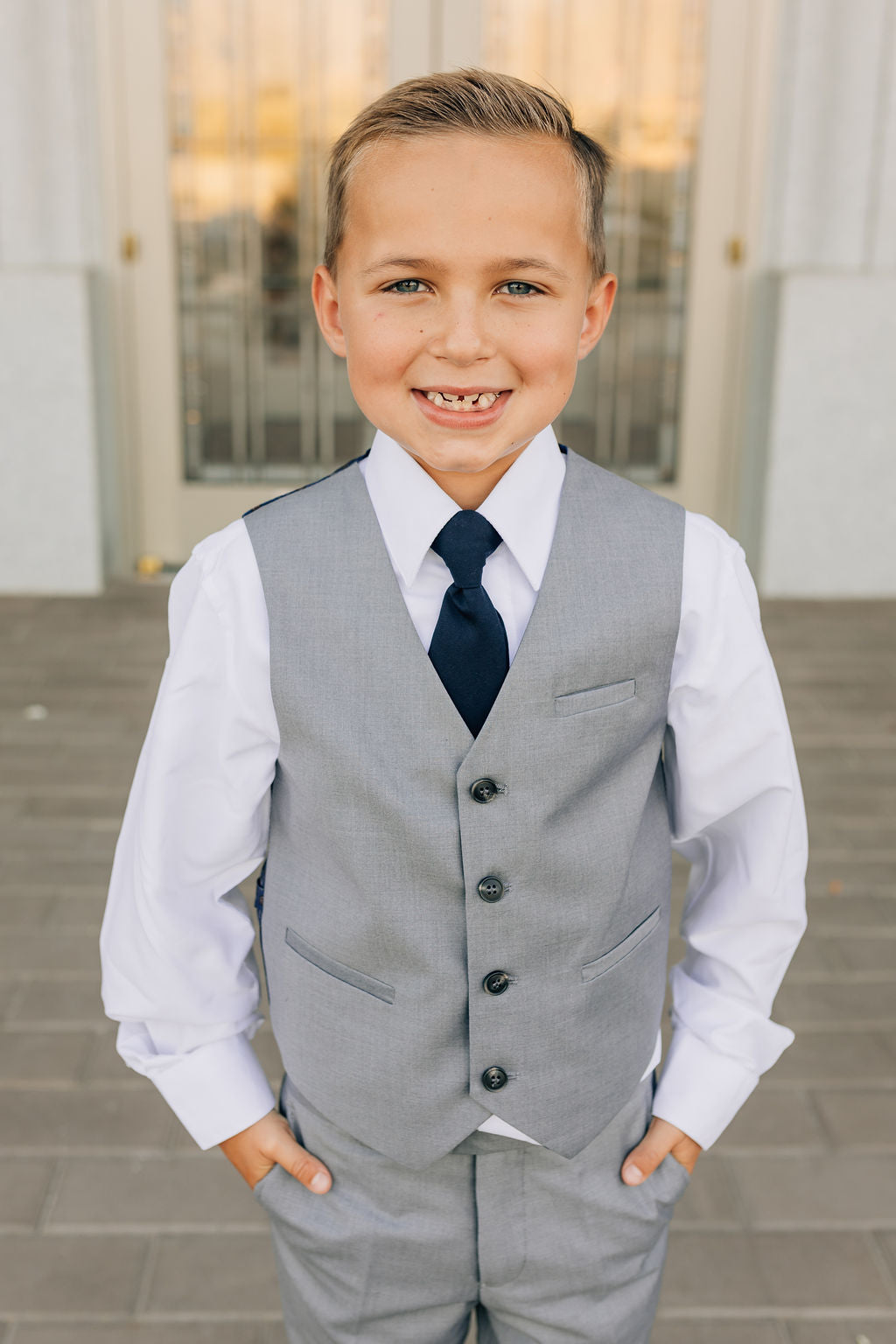 boy in gray vest and matching pants