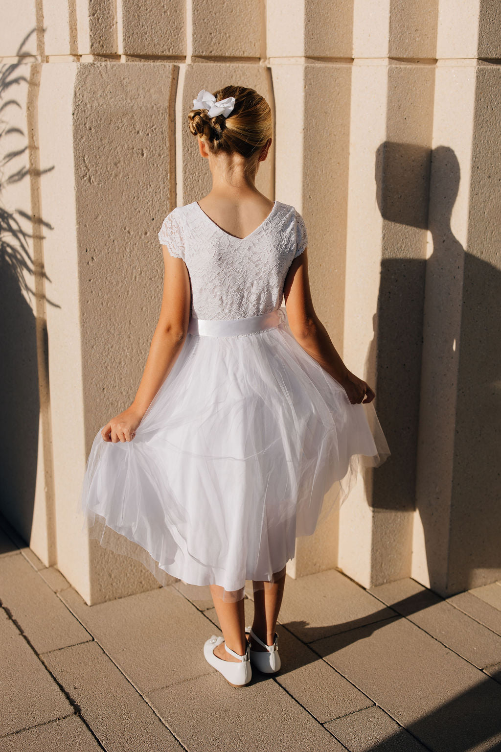 girl in white dress with tulle skirt
