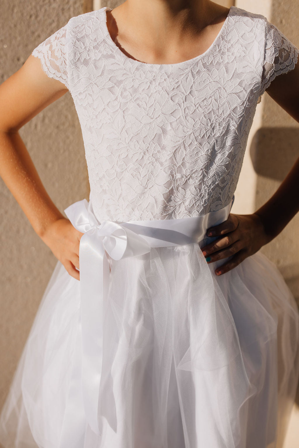 girl in white dress with tulle skirt