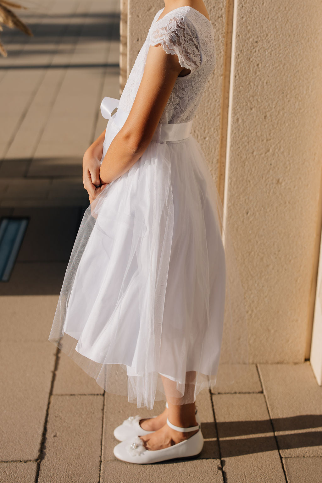 girl in white dress with tulle skirt