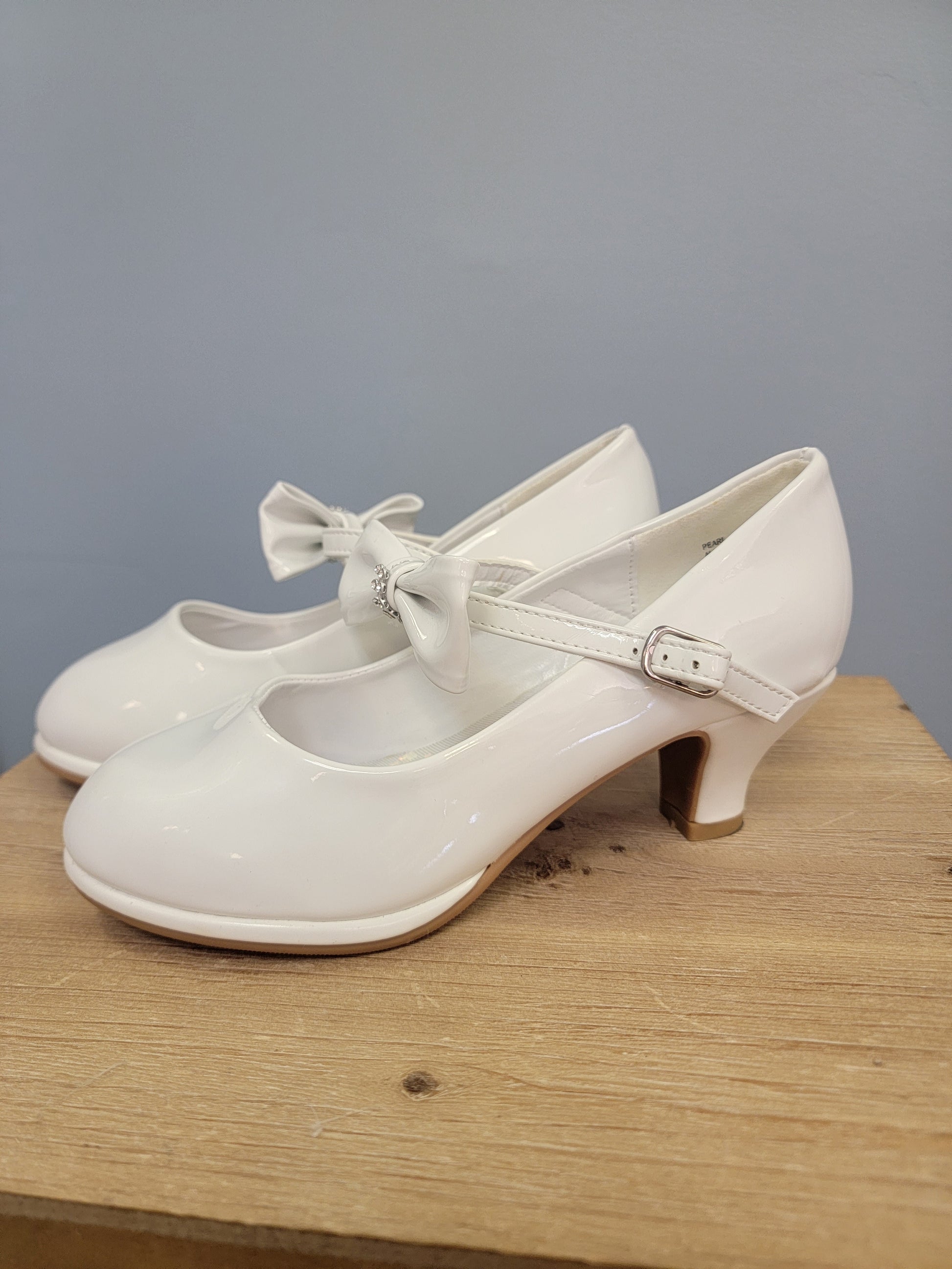 girls white heels with strap and bow