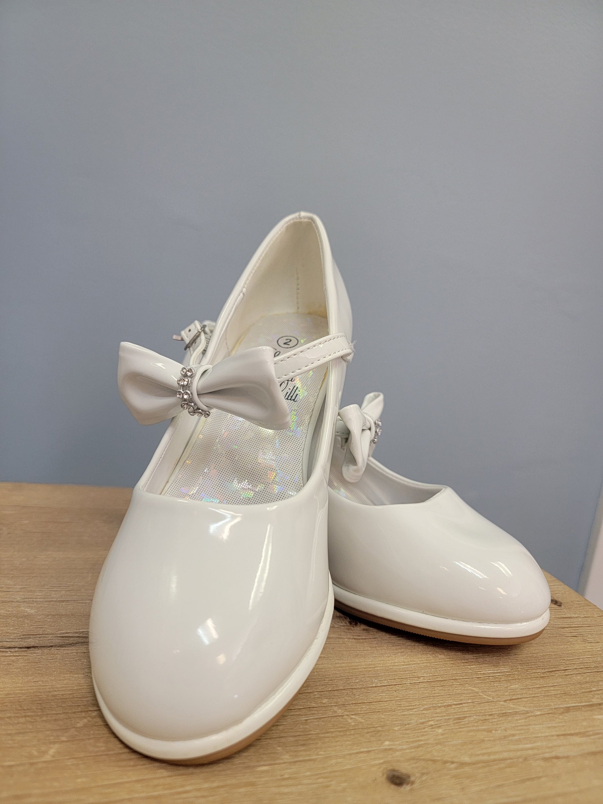 girls white heels with strap and bow