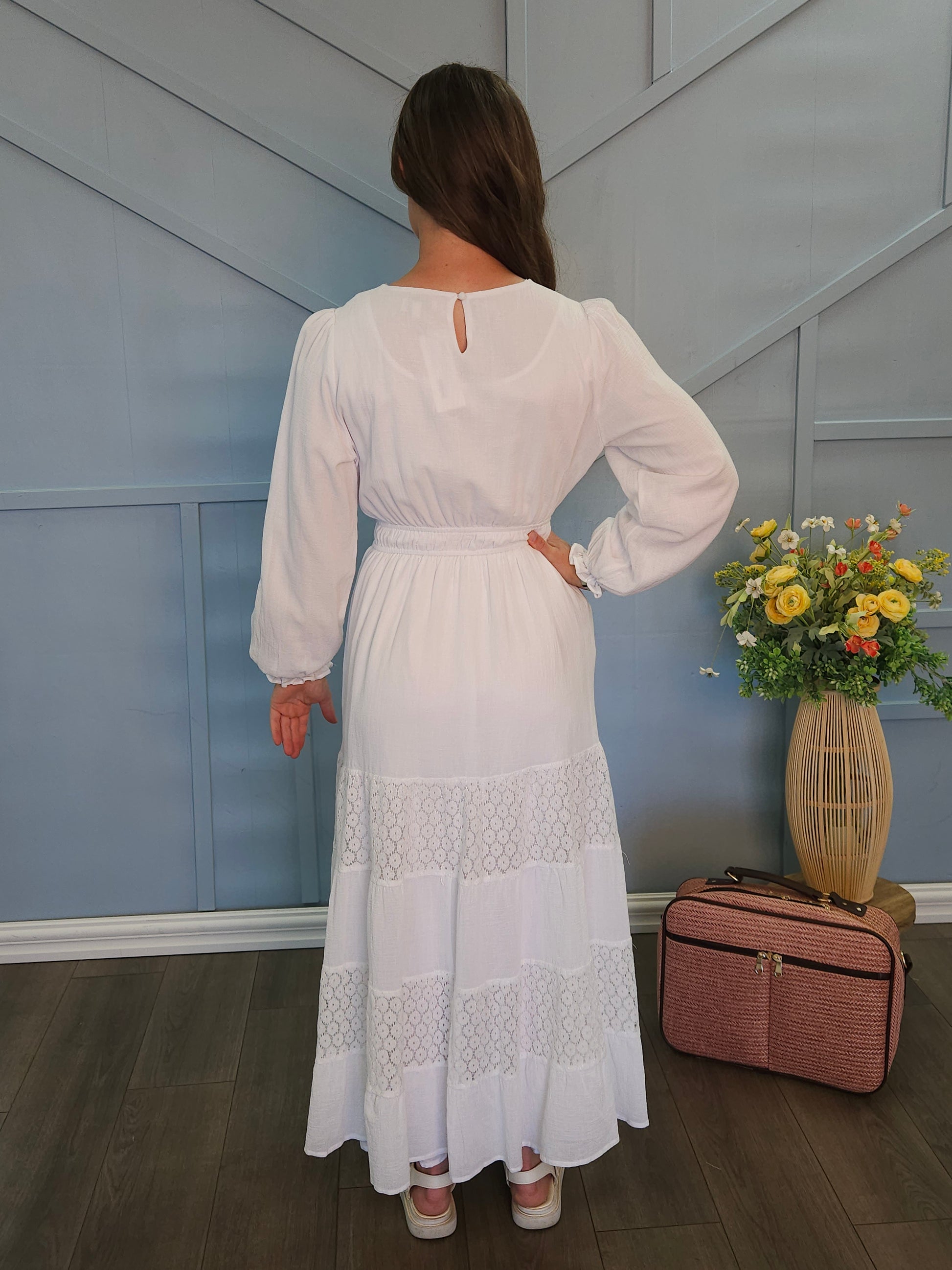 White dress with lace panel skirt.
